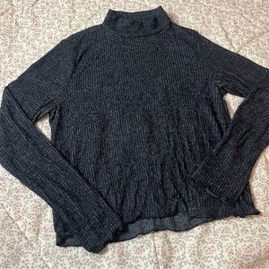 Ripped turtleneck sweater